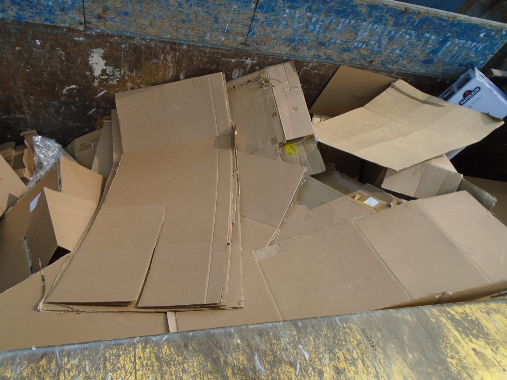 Piles of used cardboard in its appropriate bin