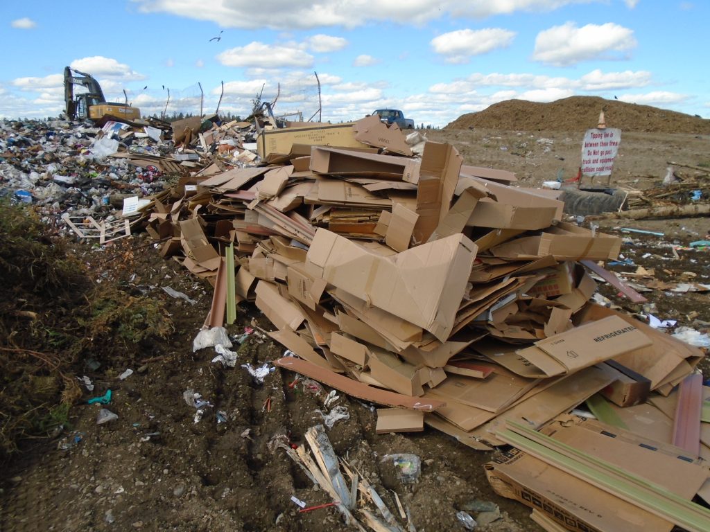 Piles of used cardboard at the dump